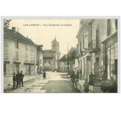 38.LES ABRETS.RUE GAMBETTA ET L'EGLISE.CAFE DU MARCHE.PATISSERIE.DARRAGO N.TABAC.CYCLES ET MOTOS MAGNAT-DEBON