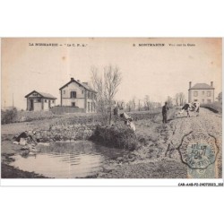 CAR-AABP2-50-0144 - MONTMARTIN - vue sur la gare - Femme lavant son linge