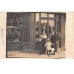 92. n°54233.COURBEVOIE. carte photo. maison. boutique. magasin. enfant. femme